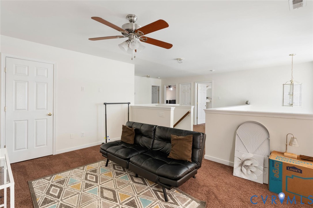 15650 River Road Chesterfield, VA 23838 - Photo 31 of 50 a living room with furniture and a ceiling fan