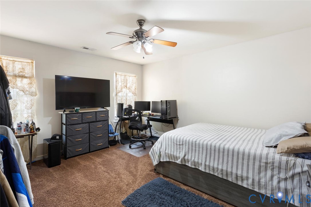 15650 River Road Chesterfield, VA 23838 - Photo 36 of 50 a bedroom with a bed and a flat screen tv