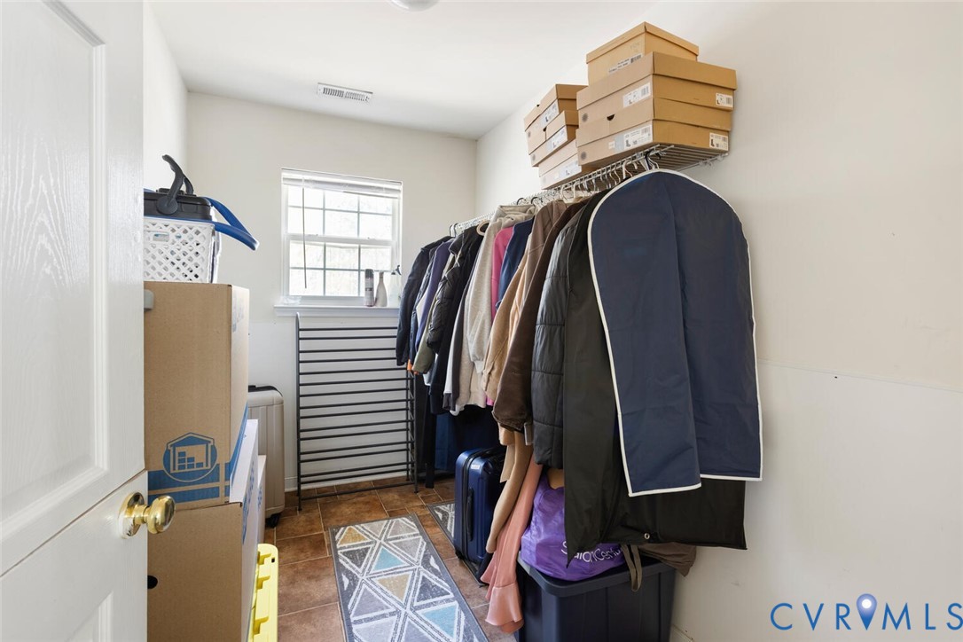 15650 River Road Chesterfield, VA 23838 - Photo 37 of 50 a view of walk in closet with clothes and shoes