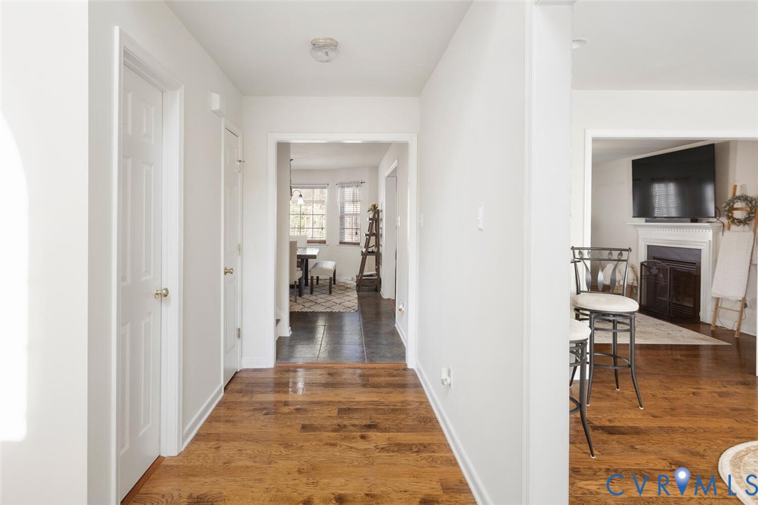 15650 River Road Chesterfield, VA 23838 - Photo 5 of 50 a hallway with wooden floor fireplace and living room