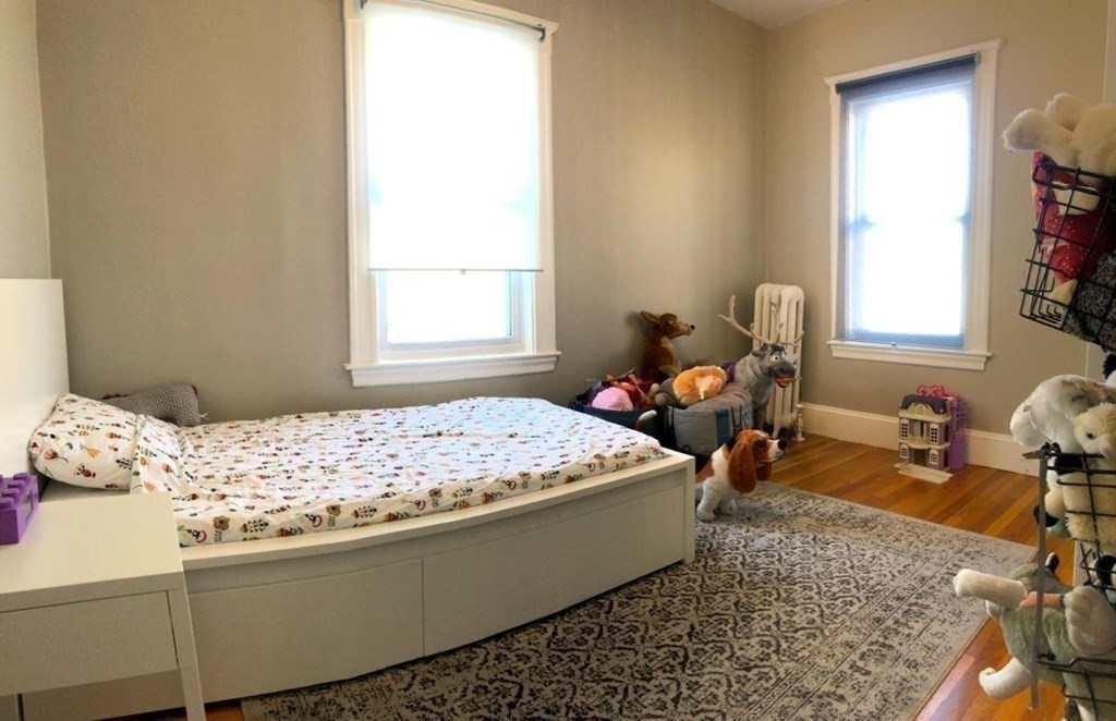 54 Lothrop Street, Unit 54 Newton, MA 02460 - Photo 6 of 13 a bedroom with bed and window