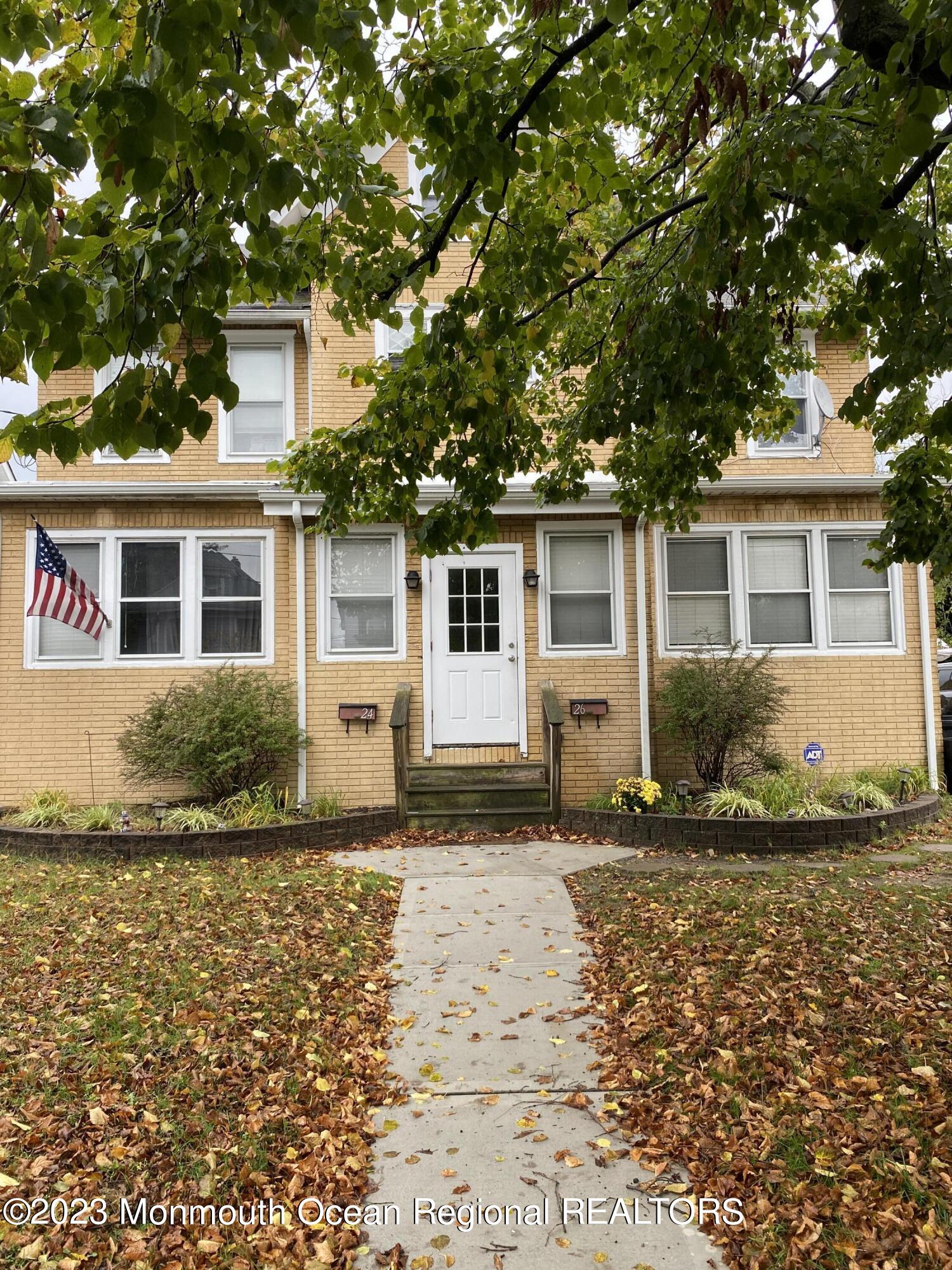 24-26 Rector Place Red Bank, NJ 07701 - Photo 1 of 6 a front view of a house with a yard