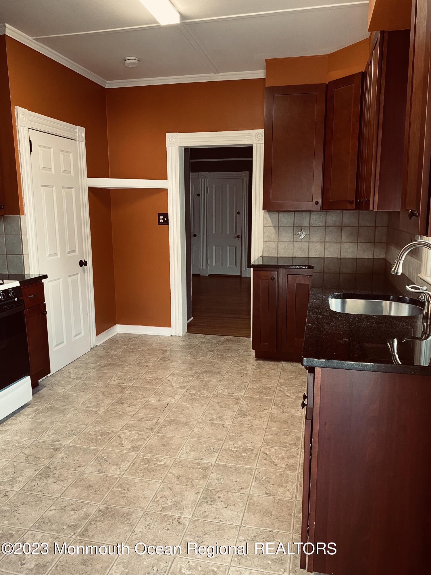 24-26 Rector Place Red Bank, NJ 07701 - Photo 2 of 6 a kitchen with a sink and cabinets