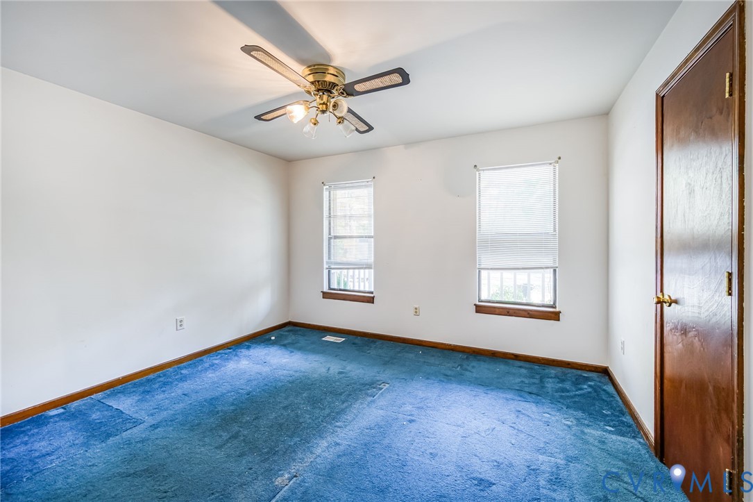 9508 Tranquility Lane Sutherland, VA 23885 - Photo 13 of 20 wooden floor in an empty room with a window