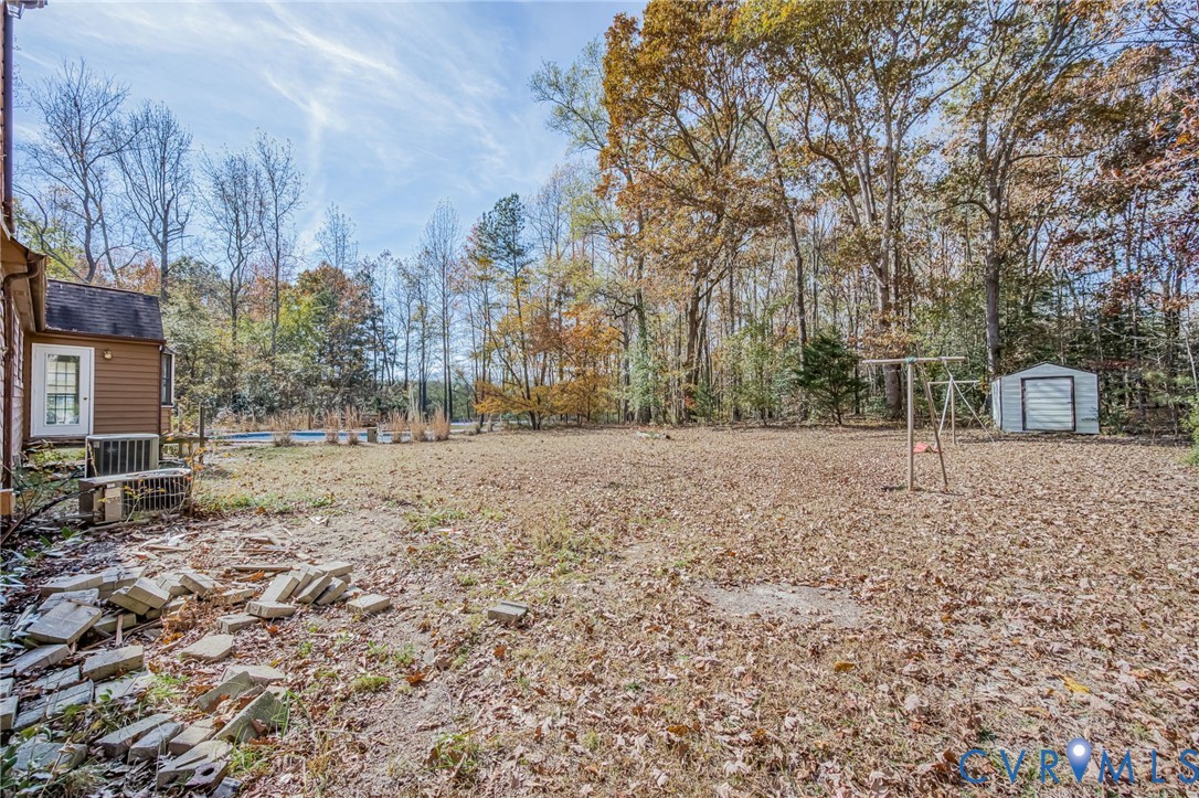 9508 Tranquility Lane Sutherland, VA 23885 - Photo 19 of 20 a view of house with a yard