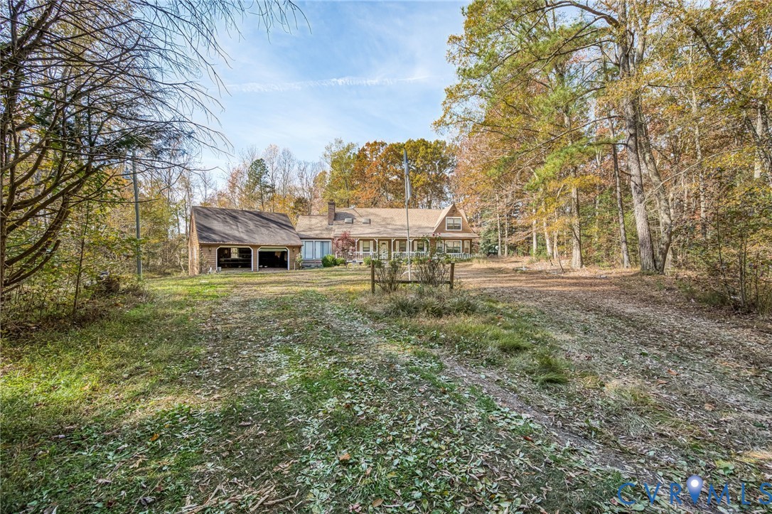 9508 Tranquility Lane Sutherland, VA 23885 - Photo 3 of 20 a front view of a house with a yard