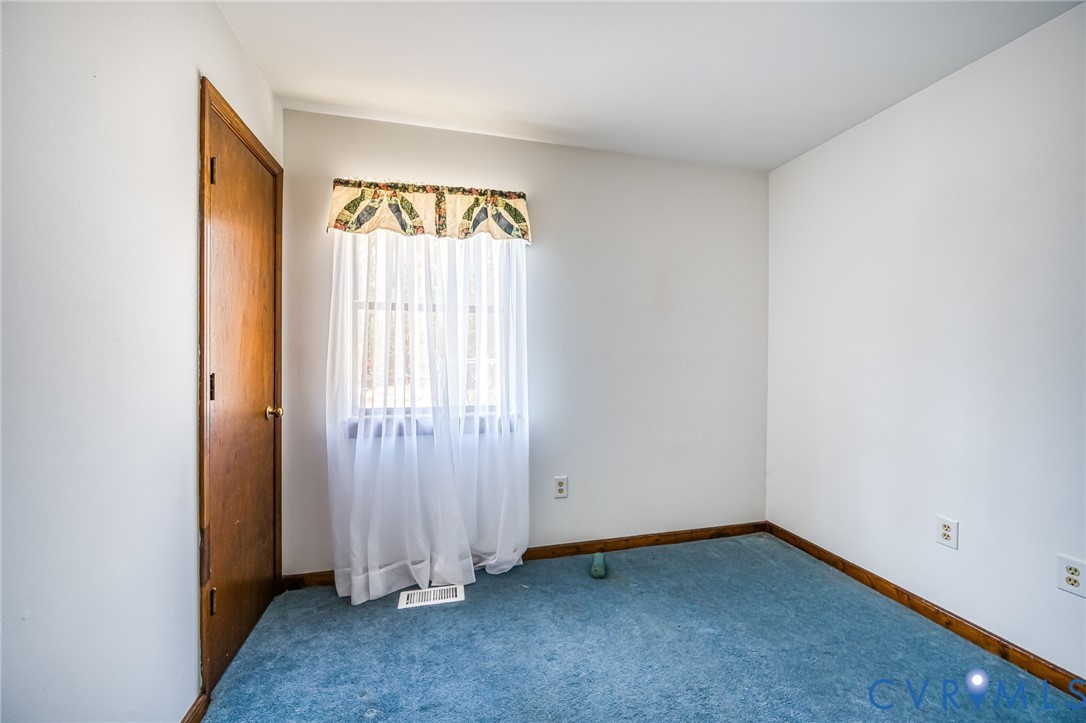 9508 Tranquility Lane Sutherland, VA 23885 - Photo 9 of 20 an empty room with a window