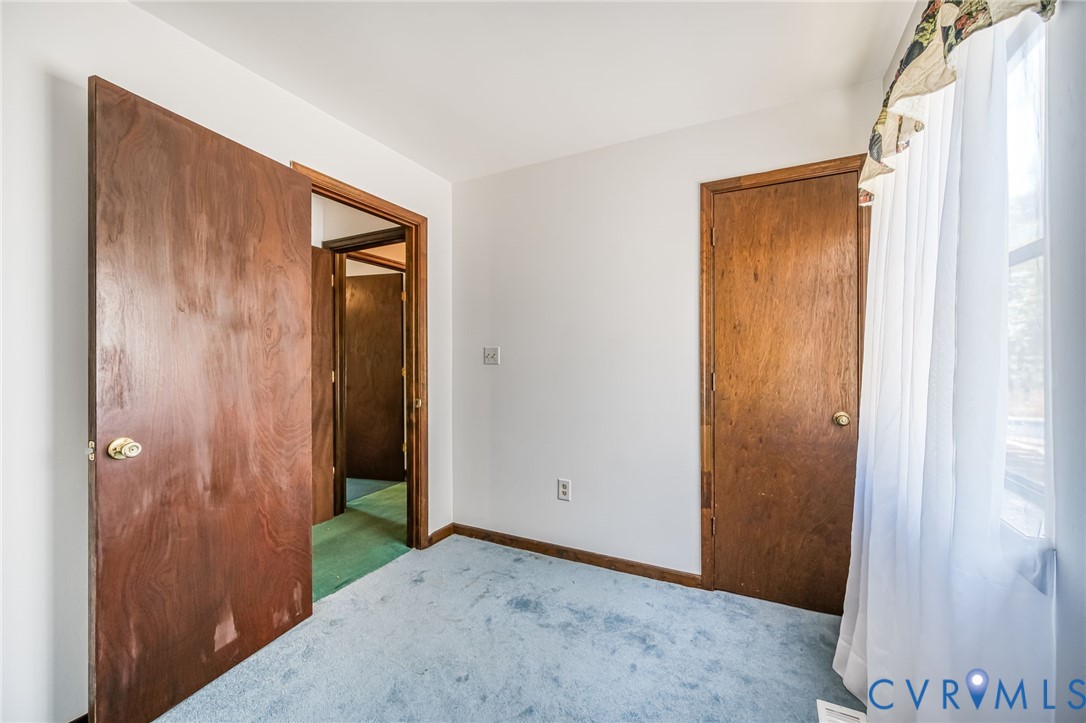 9508 Tranquility Lane Sutherland, VA 23885 - Photo 10 of 20 a view of a hallway with closet area