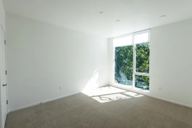 a bathroom with a toilet a sink and a mirror