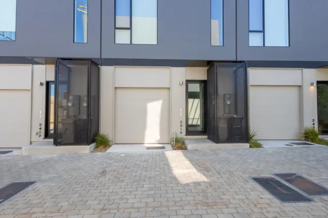 a view of a building with potted plants