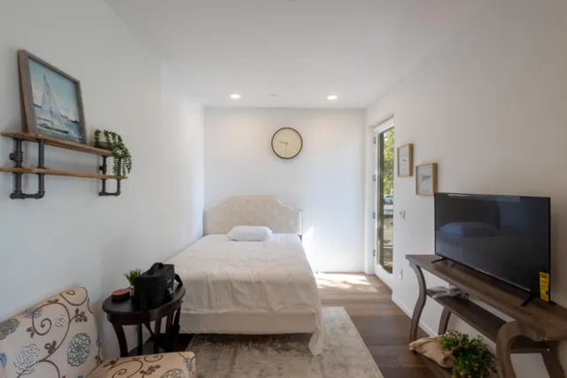a kitchen with stainless steel appliances a sink stove and microwave