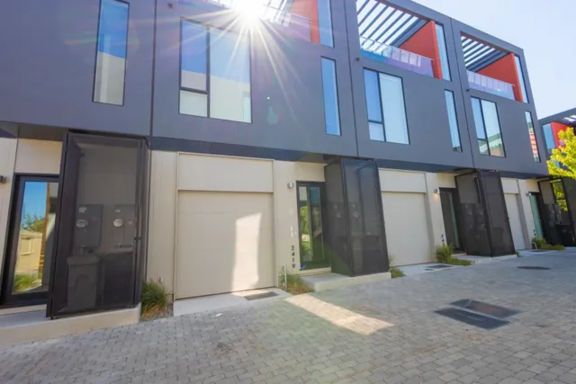 a view of a brick building with many windows