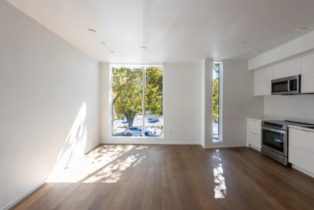 a kitchen with a stove a sink and a microwave