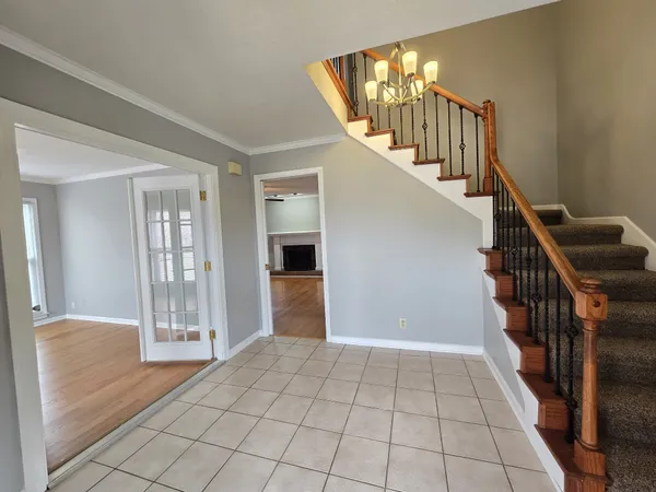 a view of an entryway with wooden floor