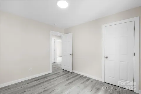 a view of wooden floor and windows in a room