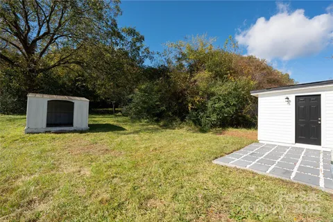 a backyard of a house with lots of green space