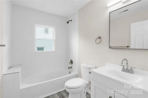 a bathroom with a sink a toilet and a bathtub