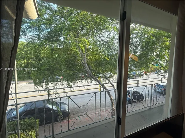 a view of swimming pool with outdoor seating and plants