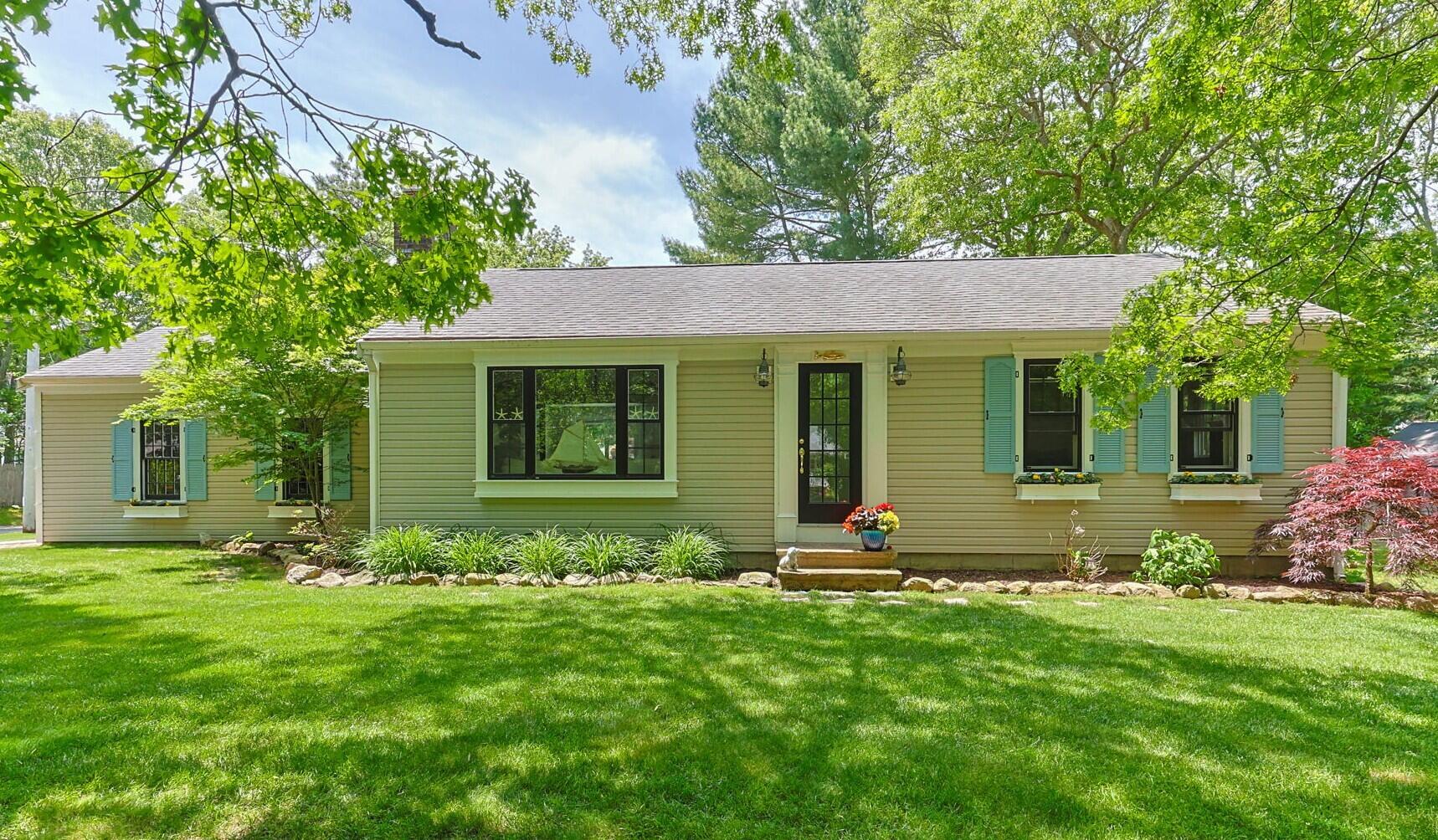 111 Richardson Road Centerville, MA 02632 - Photo 1 of 48 a view of a house with sitting area and garden
