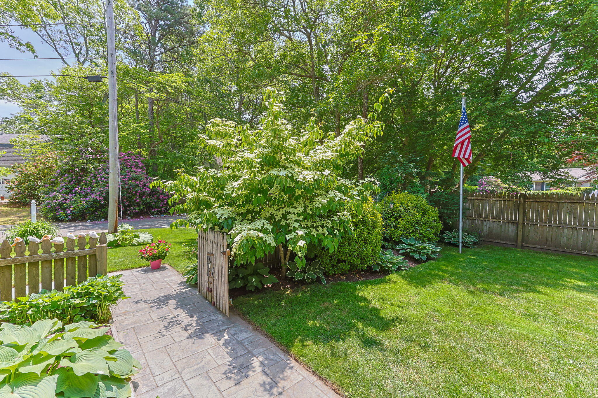 111 Richardson Road Centerville, MA 02632 - Photo 38 of 48 a backyard of a house with lots of green space