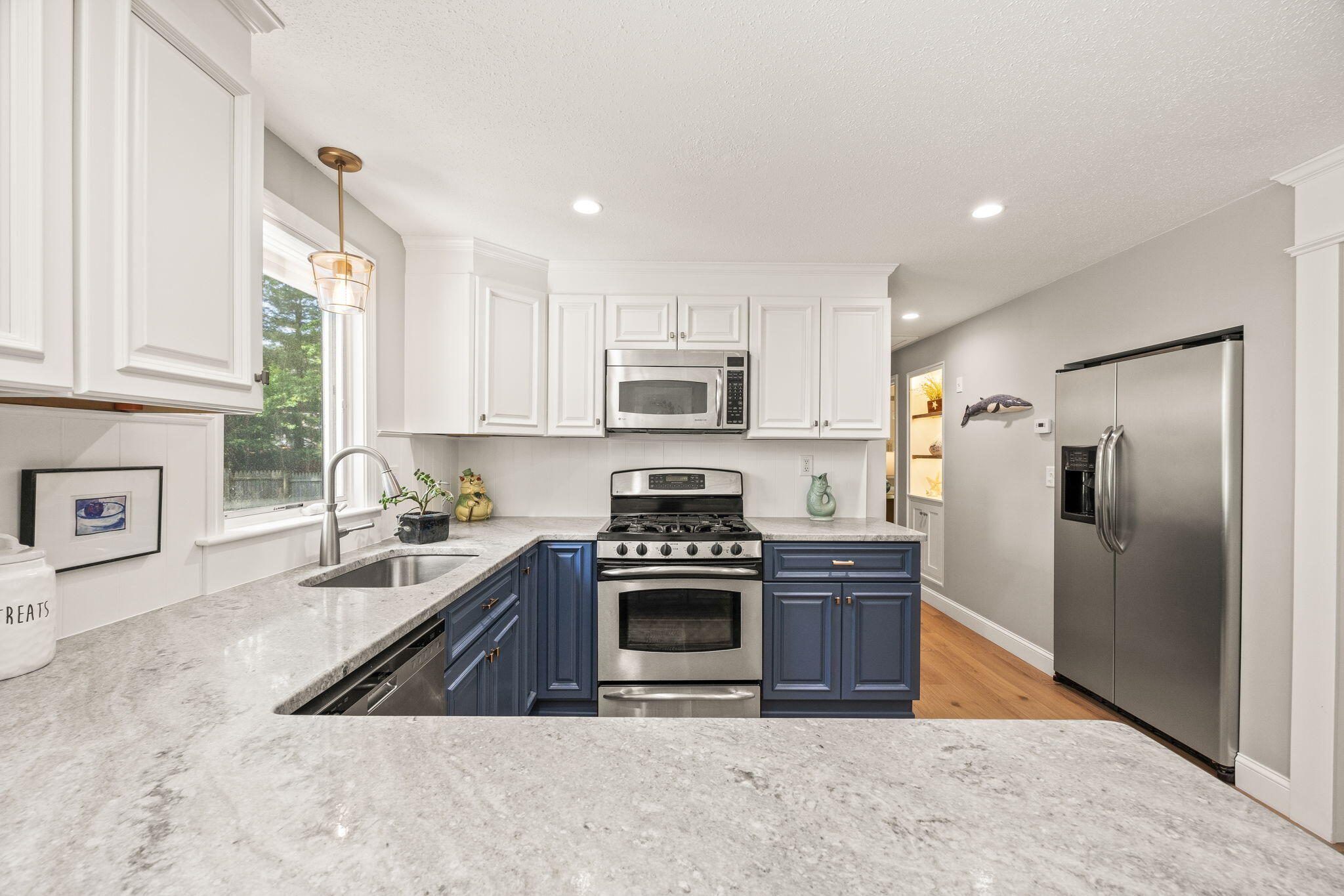 111 Richardson Road Centerville, MA 02632 - Photo 7 of 48 a kitchen with stainless steel appliances granite countertop a stove a refrigerator and a sink