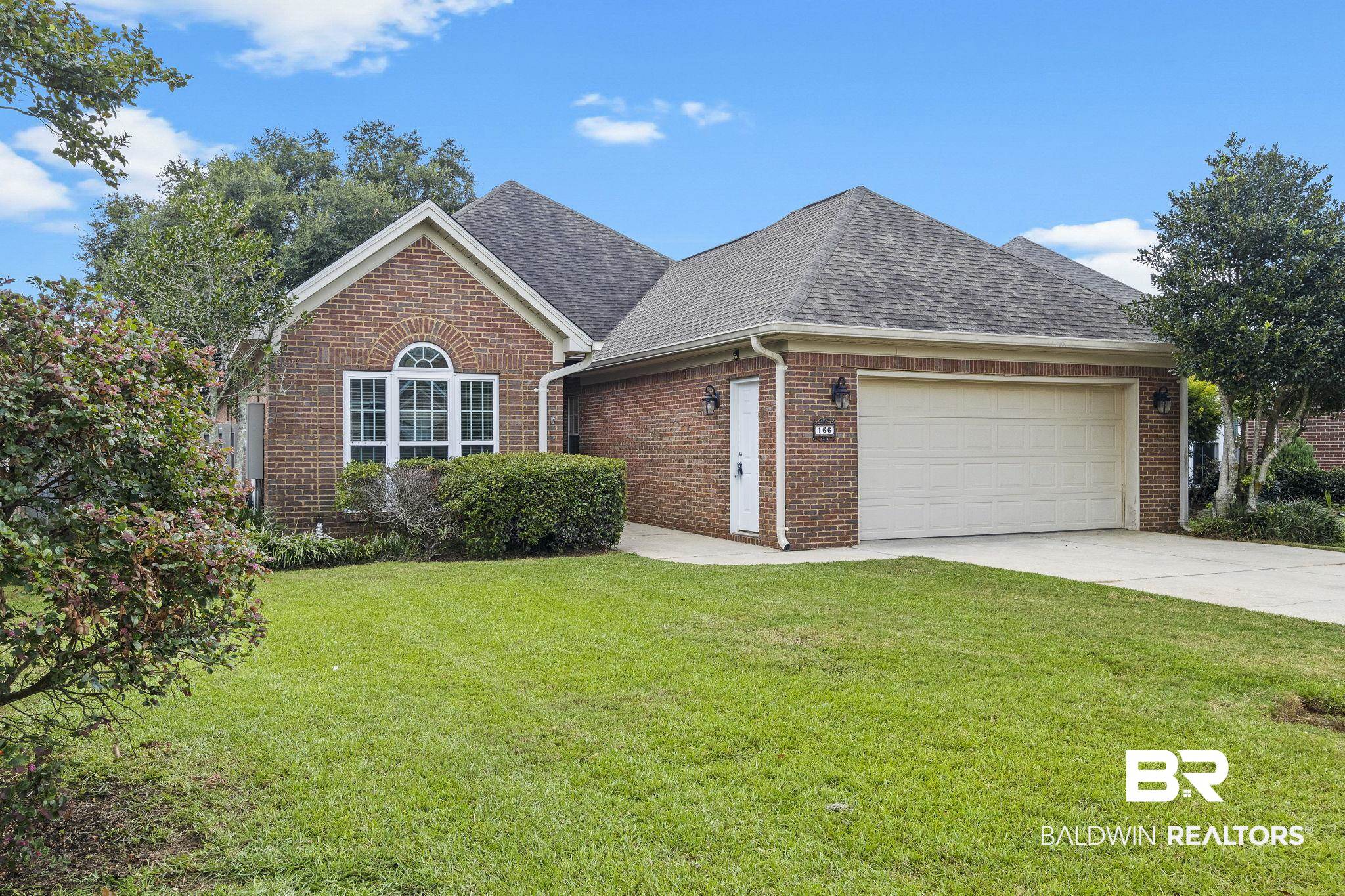166 Club Drive Fairhope, AL 36532 - Photo 2 of 41 View of front of house featuring a front yard and a garage