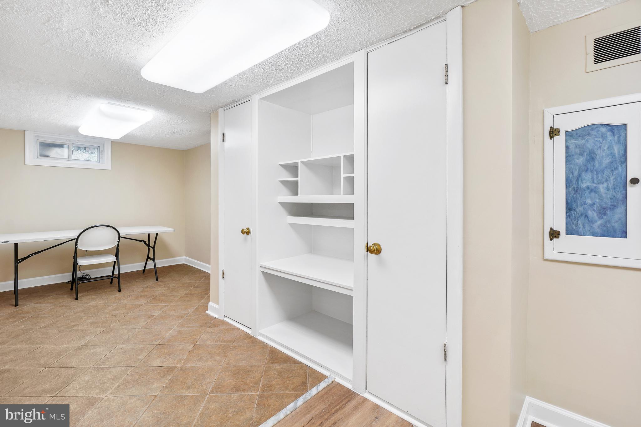 12311 Middle Road Silver Spring, MD 20906 - Photo 20 of 33 Basement Level with Built-in Cabinetry