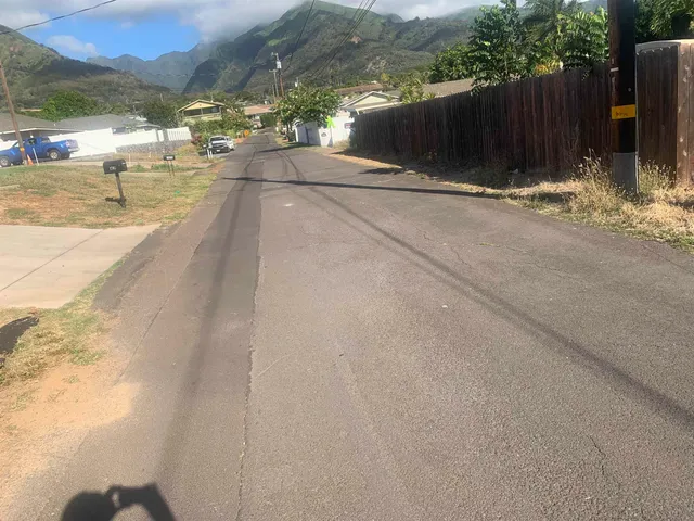 a view of a backyard of the house