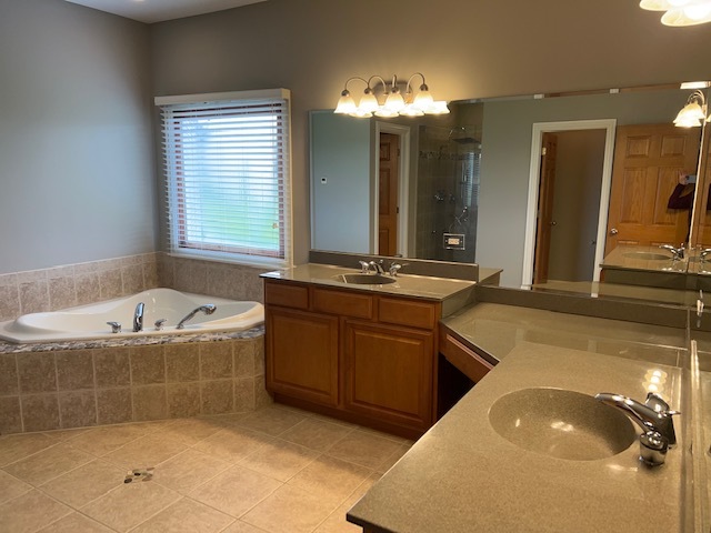 10902 Zarnstorff Road Richmond, IL 60071 - Photo 4 of 14 a spacious bathroom with a tub sink and mirror
