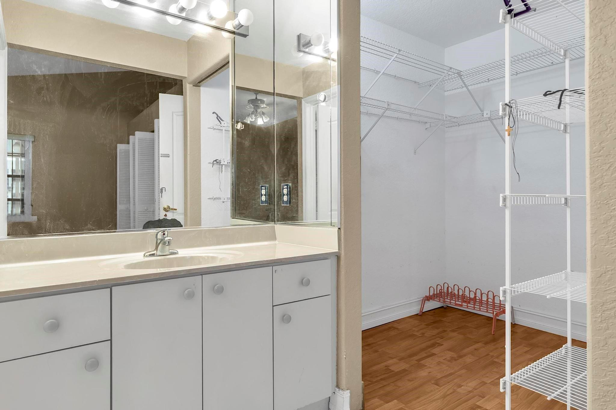 3201 West 76th Street Hialeah, FL 33018 - Photo 32 of 46 a bathroom with a granite countertop sink mirror and shower