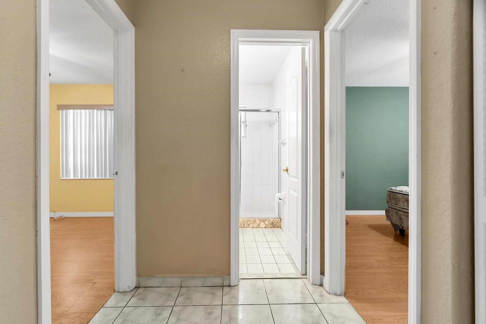 3201 West 76th Street Hialeah, FL 33018 - Photo 34 of 46 a view of a bathroom from a corridor