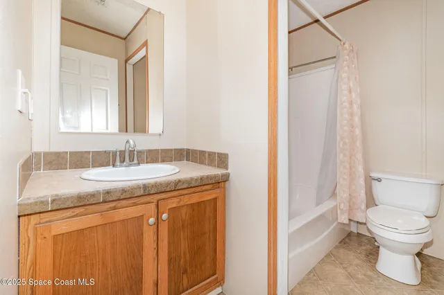 a view of an empty room and a window