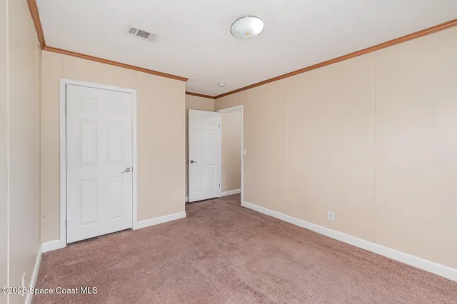 a kitchen with stainless steel appliances granite countertop a refrigerator a stove and a sink with wooden floor