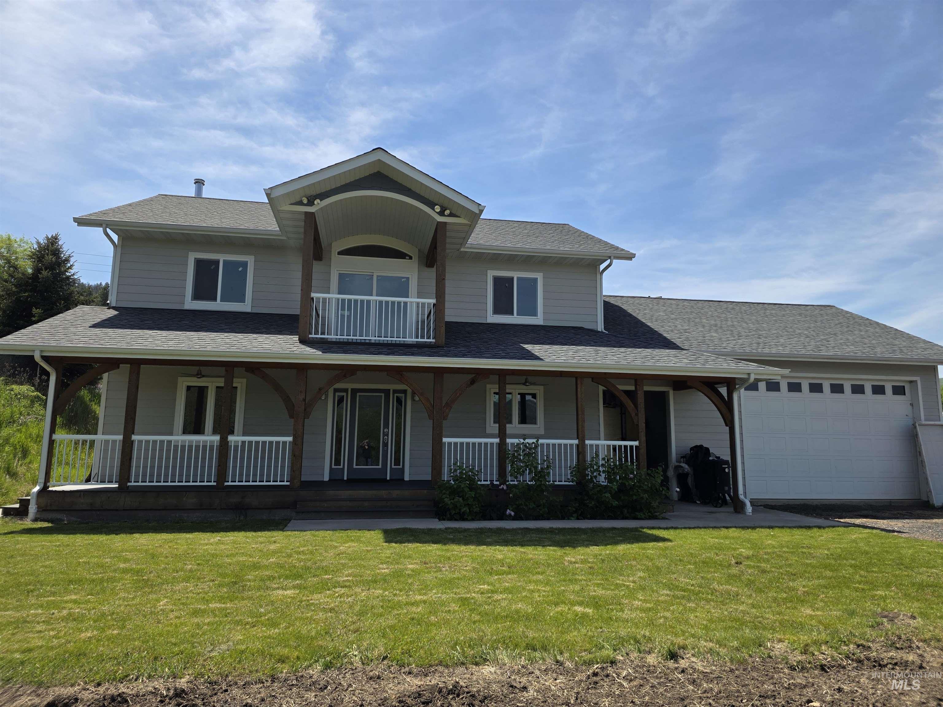107 Pine Road Kamiah, ID 83536 - Photo 1 of 41 Two-story residence featuring light gray siding and a dark shingle roof