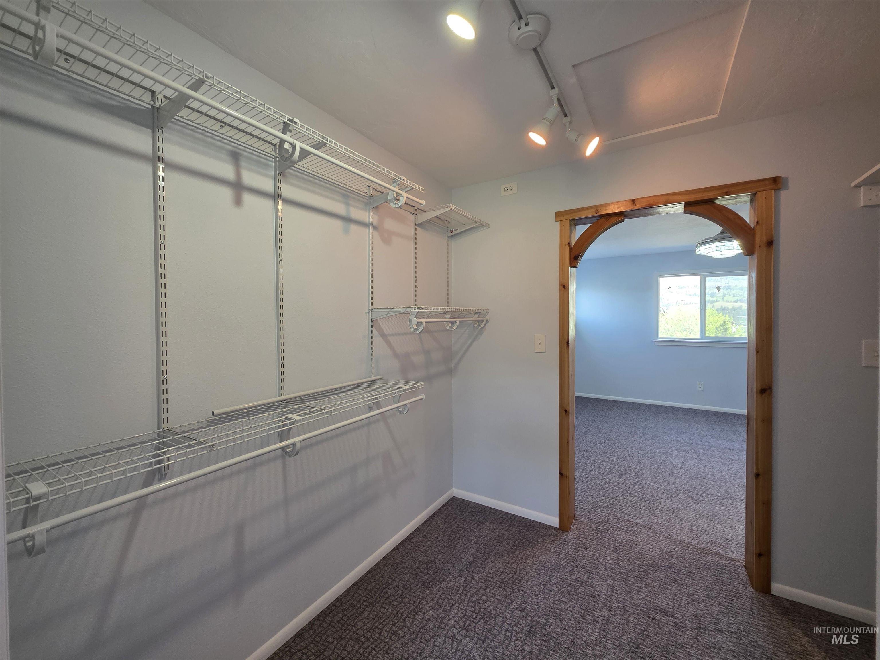 107 Pine Road Kamiah, ID 83536 - Photo 25 of 41 Walk-in closet with adjustable wire shelving and hanging rods