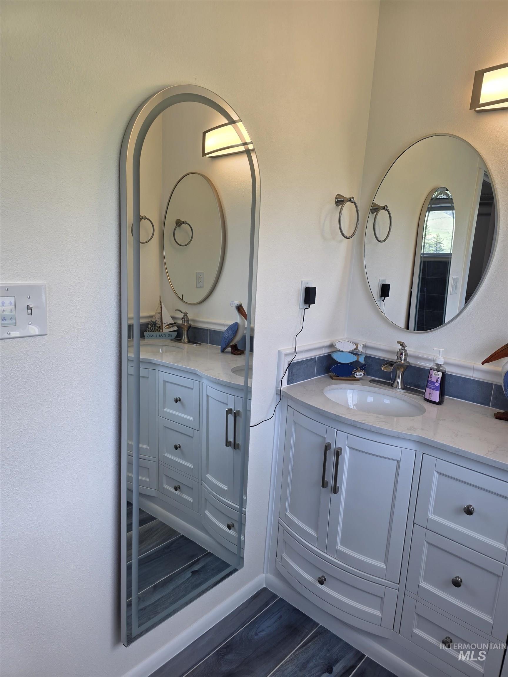 107 Pine Road Kamiah, ID 83536 - Photo 27 of 41 Double vanity with light cabinetry and stone countertops