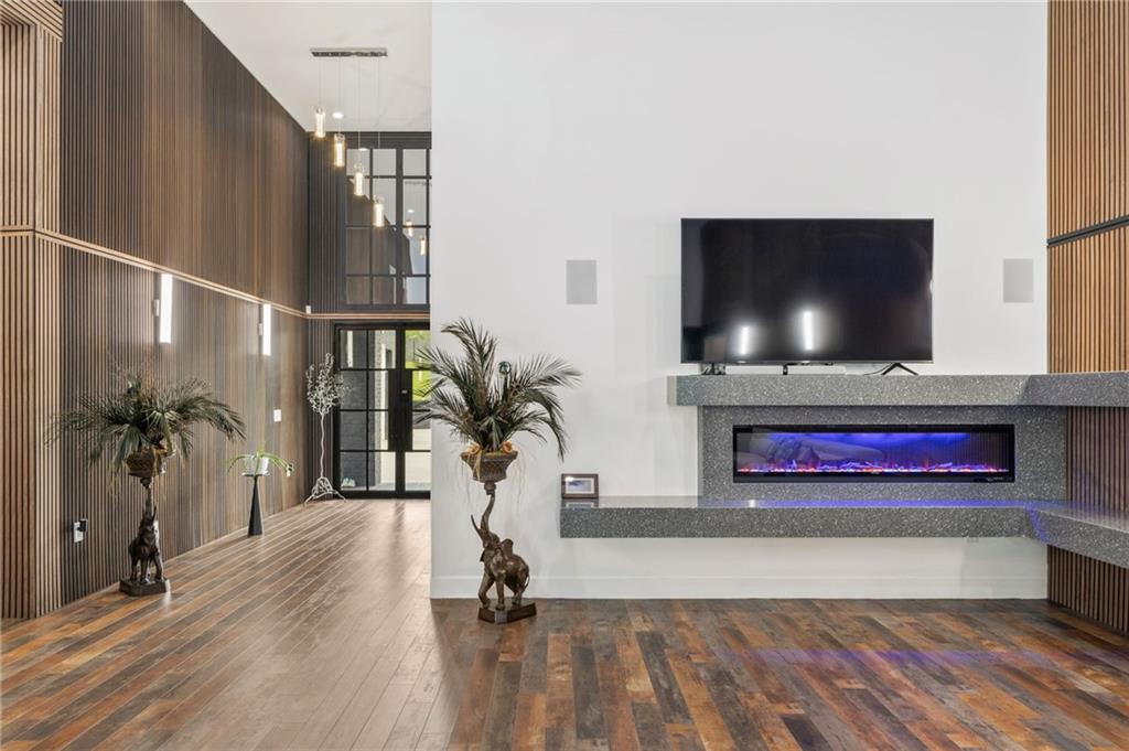 3240 Smithtown Road Suwanee, GA 30024 - Photo 17 of 94 a living room with furniture and a flat screen tv