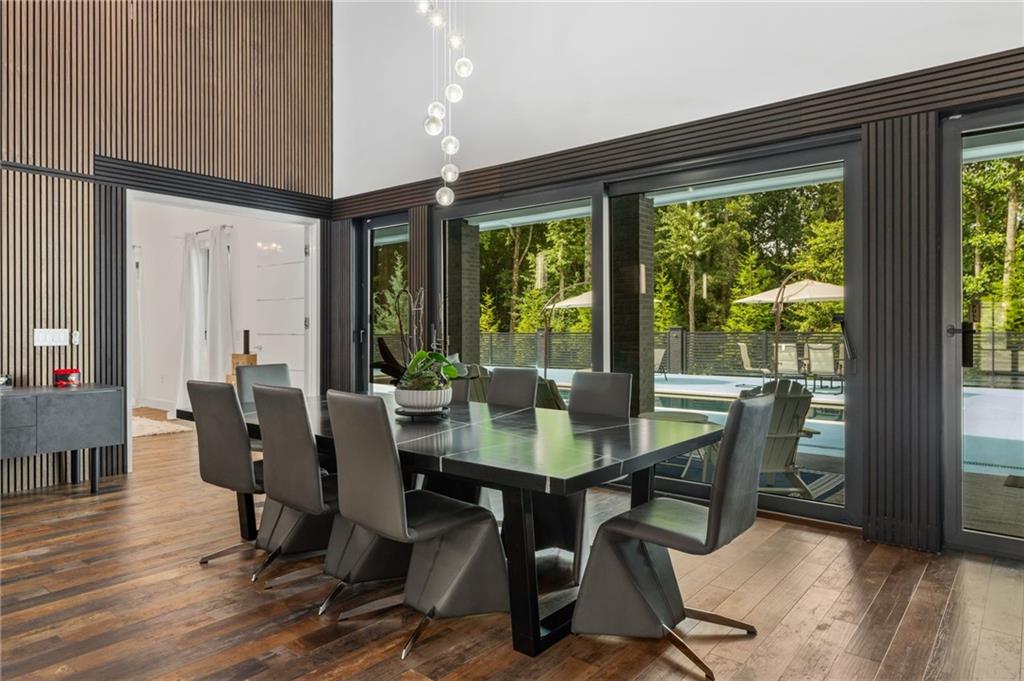 3240 Smithtown Road Suwanee, GA 30024 - Photo 24 of 94 a view of a dining room with furniture window and wooden floor
