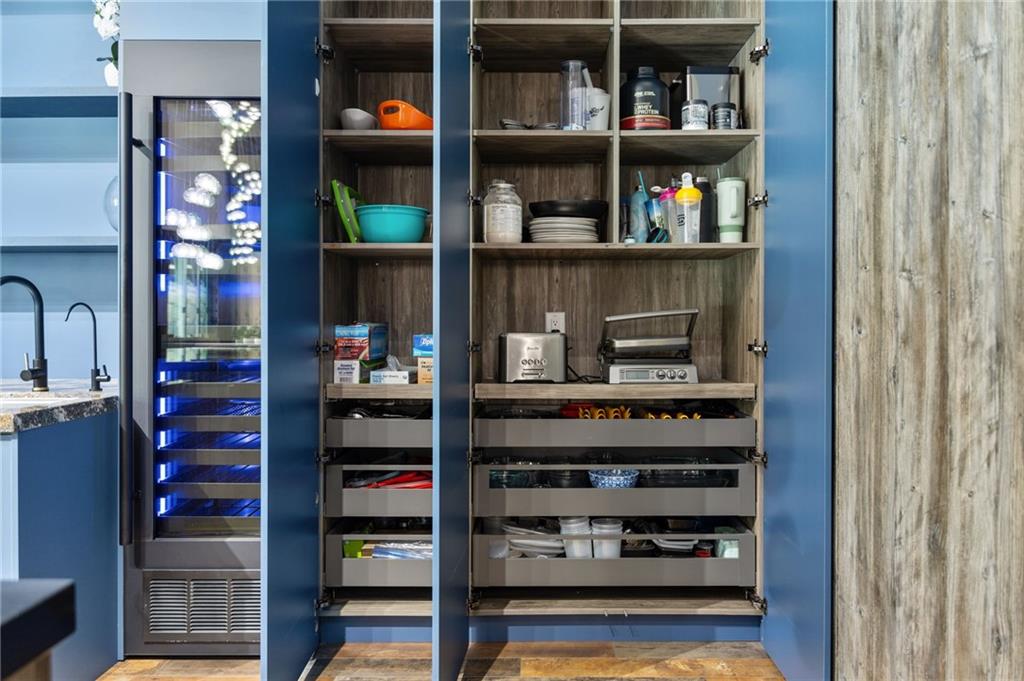 3240 Smithtown Road Suwanee, GA 30024 - Photo 34 of 94 a shelf with books and knick knacks on it