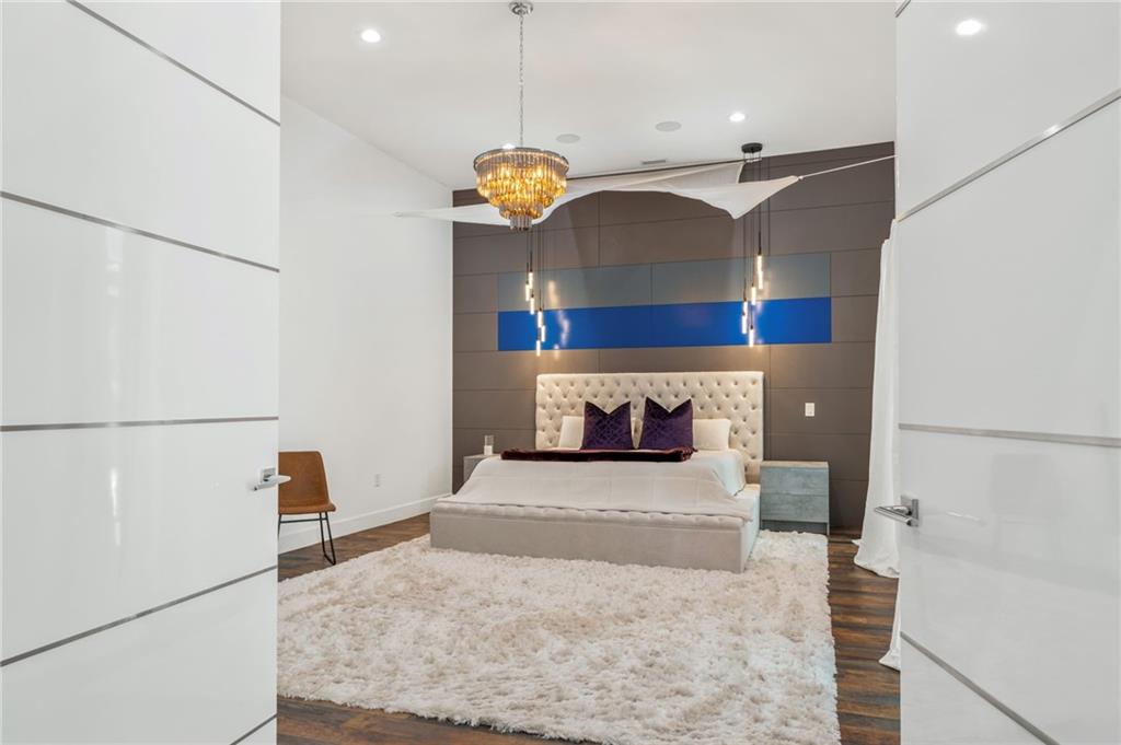 3240 Smithtown Road Suwanee, GA 30024 - Photo 41 of 94 a view of a living room with furniture and a chandelier