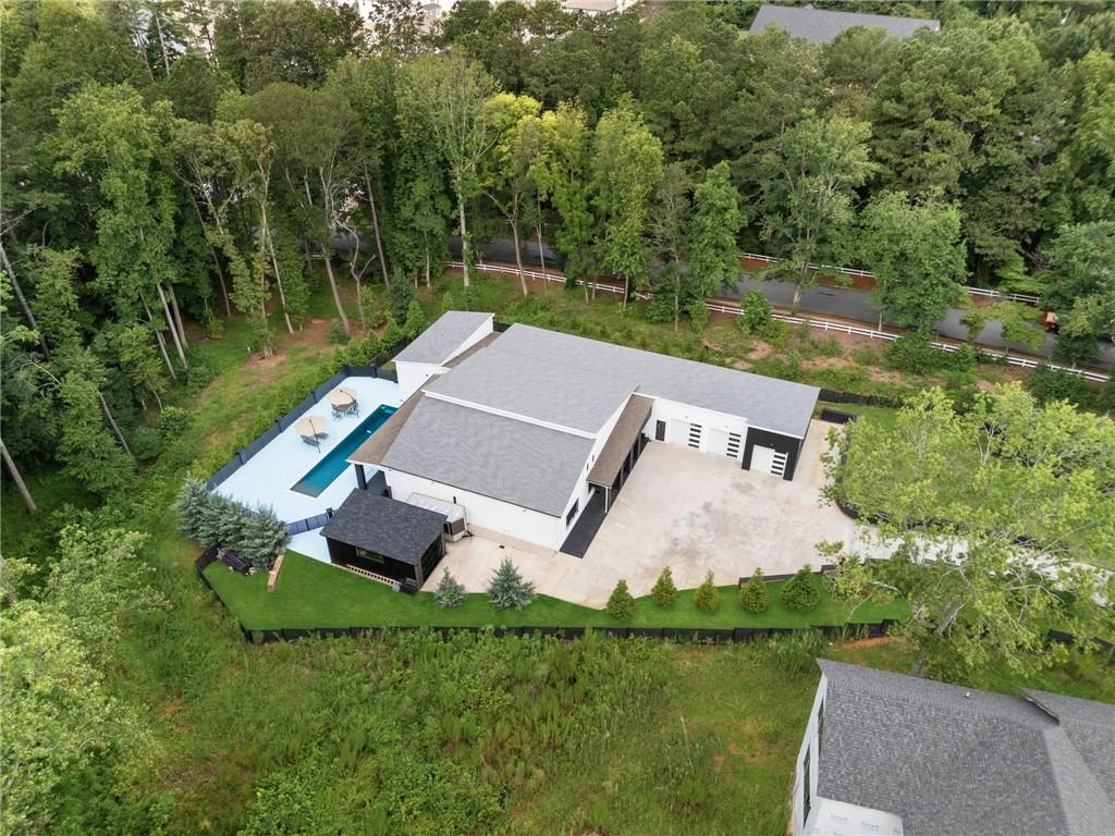 3240 Smithtown Road Suwanee, GA 30024 - Photo 66 of 80 an aerial view of a house with pool