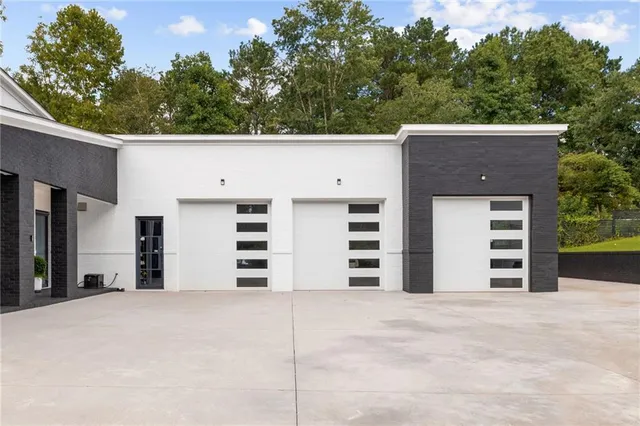 a kitchen with kitchen island a sink and a refrigerator