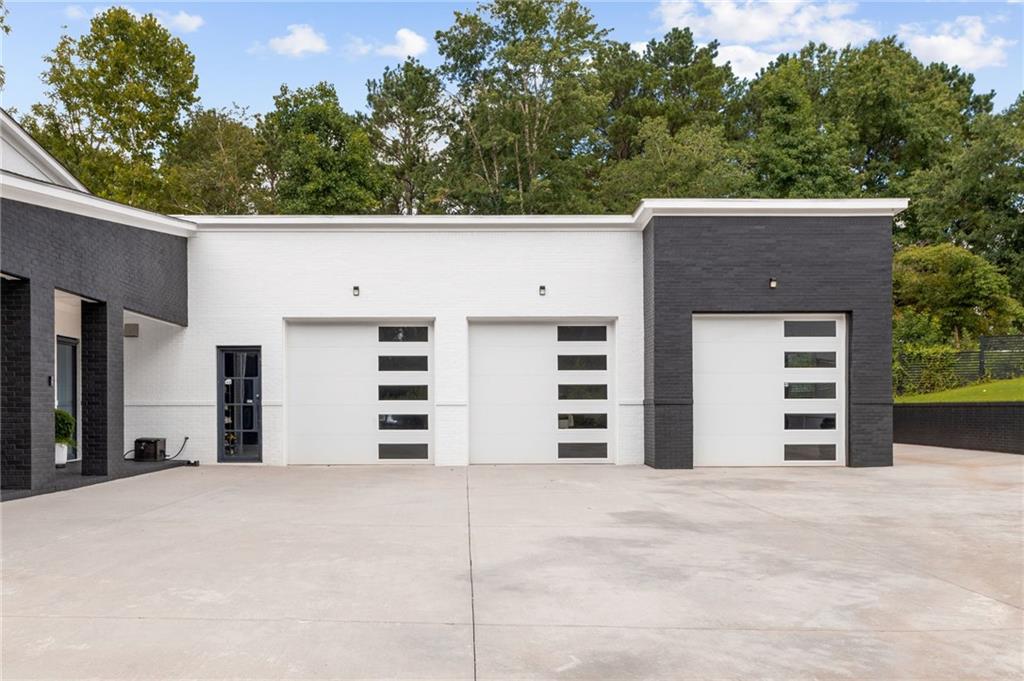 3240 Smithtown Road Suwanee, GA 30024 - Photo 7 of 94 front view of a house with a yard