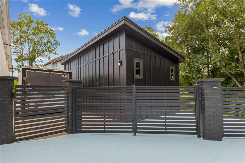 3240 Smithtown Road Suwanee, GA 30024 - Photo 76 of 94 a view of house with a small yard