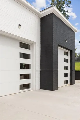 a kitchen with stainless steel appliances granite countertop a sink and a wooden floor