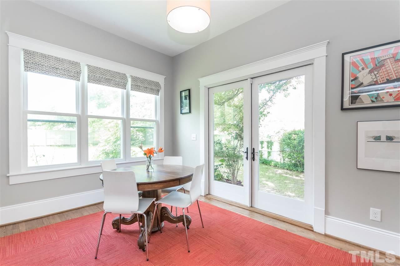 203 Forest Road Raleigh, NC 27605 - Photo 15 of 30 a view of a workspace with furniture and a window