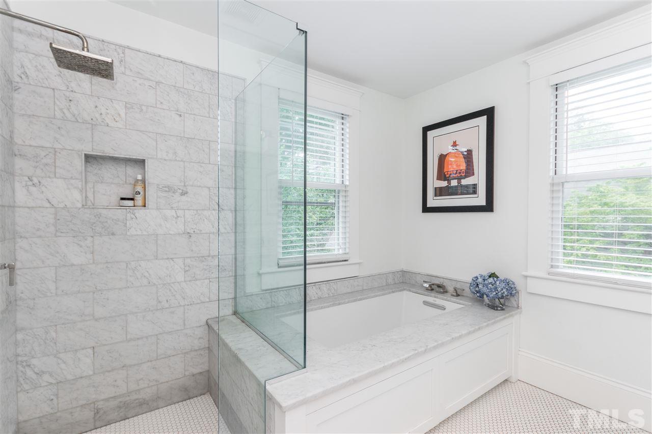 203 Forest Road Raleigh, NC 27605 - Photo 23 of 30 a bathroom with a tub and a shower
