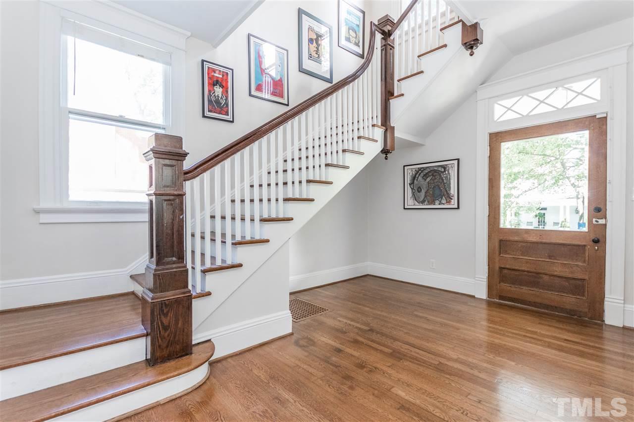 203 Forest Road Raleigh, NC 27605 - Photo 6 of 30 a view of entryway and hall with wooden floor