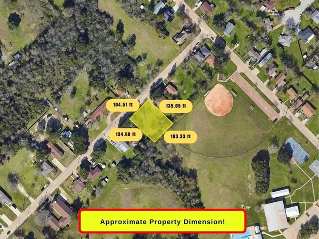 an aerial view of a house with a swimming pool