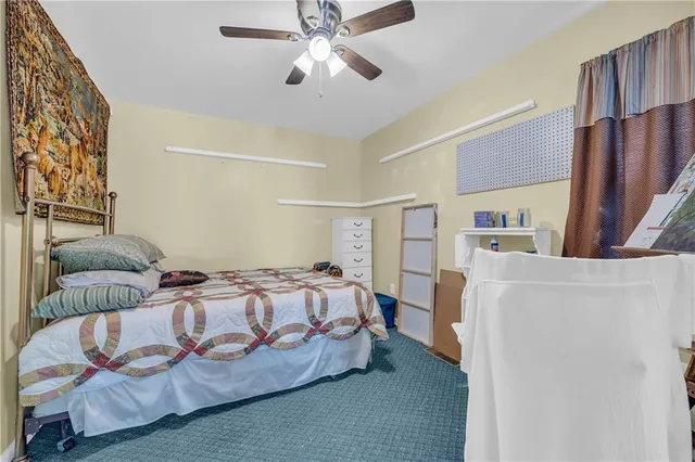 a bedroom with a bed and a couch